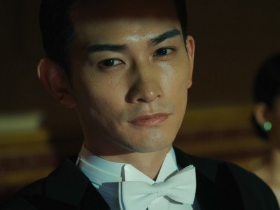 Sugiki looks at the camera.