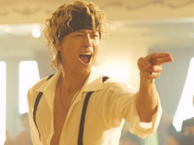 Suzuki dances happily.