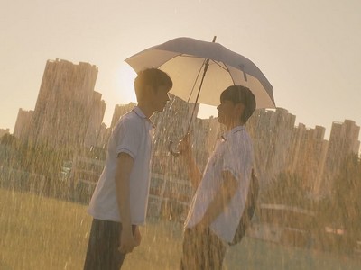 Dongwook and Dohyun confront each other in the rain.