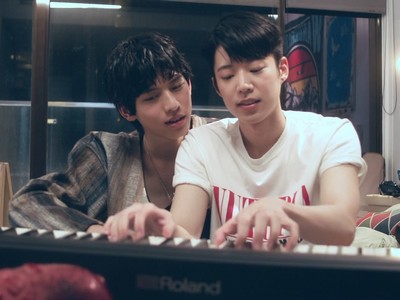 Ray and Jian play the piano together.