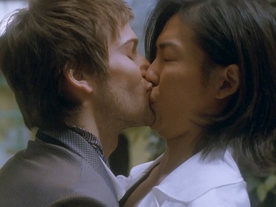 Sun Woo and Jean-Baptiste share an awkward kiss.