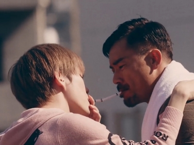 Kohei and Yuta share an intimate moment while smoking cigarettes.