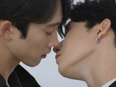 Ki Jin and Yeong Woo almost kiss during a photoshoot.