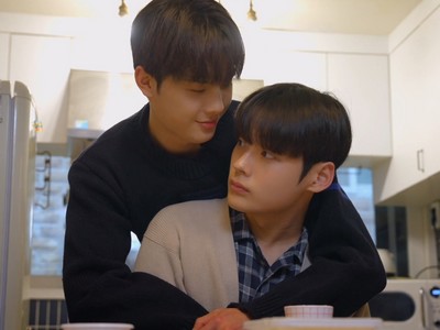 Yoon Chan wraps his arms around Min Jae.