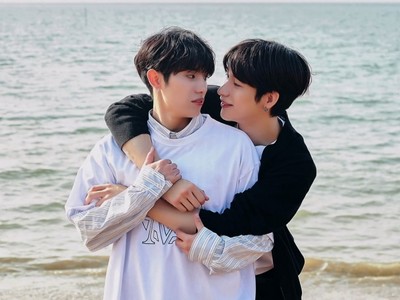 Eden and Jihoon embrace each other on the beach.