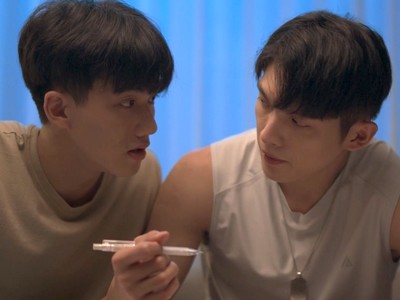 Lai Fan and Zheng Tao Yang stare at each other.