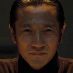 Kurozu is portrayed by the Japanese actor Kanji Tsuda (津田寛治).