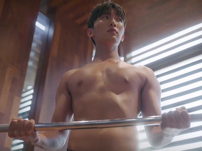 Sung Hoon lifts weights while shirtless.