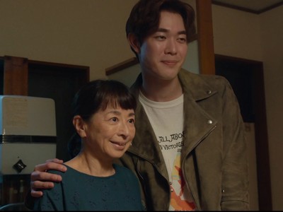 Ryuta poses for a picture with his mom.