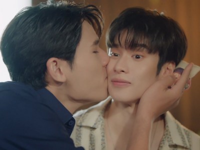 Scent kisses Gaysorn on the cheek.