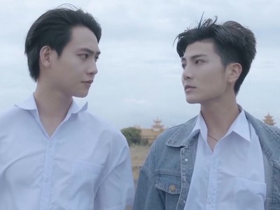 Trieu and Thien stare at each other.