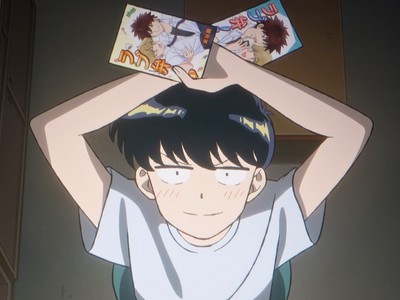 Nakamura holds up his two BL manga.
