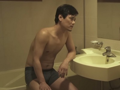 Yong Guen is shirtless in the bathroom.