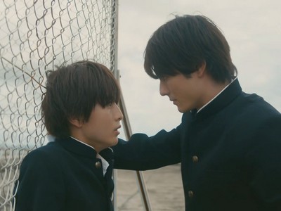 Yamato and Kakeru confront each other's feelings on the school rooftop.