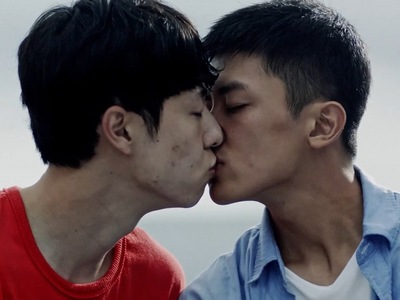 Minha and Sangbeom share a passionate kiss.