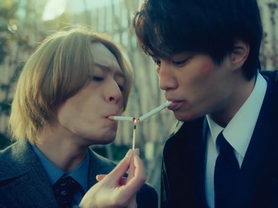 Ichiro and Shiro smoke a cigarette together.