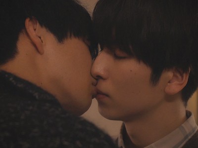 Miyata and Takashi share a kiss as adults.