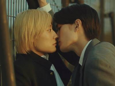 Madoka and Tsuru almost kiss.