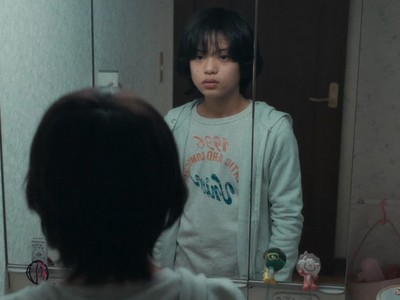 Minato stares at his mirror reflection.
