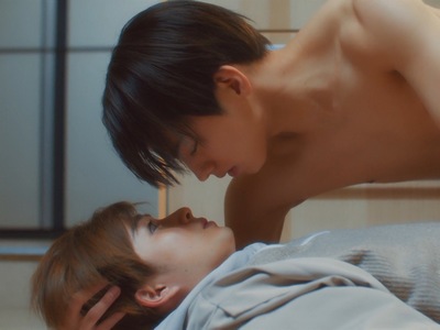 Kota and Naoya almost share a kiss in the apartment.