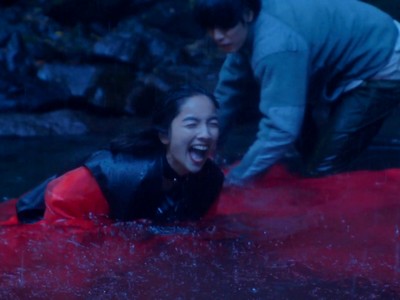 Anna laughs during a waterfall photoshoot.