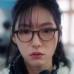 The director is portrayed by a Korean actress.