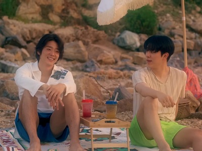 Do Gun and Jung Woo enjoy the sunset together on the beach.