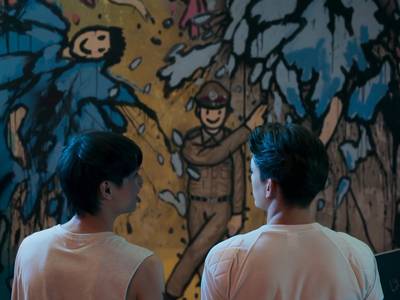 Yok and Dan look at his mural together.