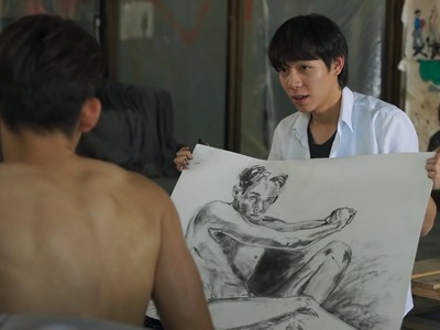 Yok draws a nude painting of Dan.