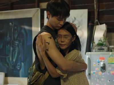 Yok gives his mom a hug.