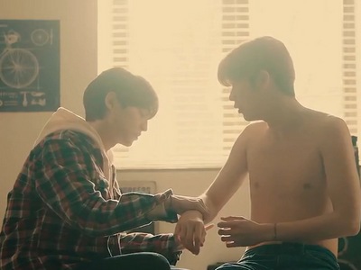 Yun Oh tends the injuries on Peach's shirtless body.