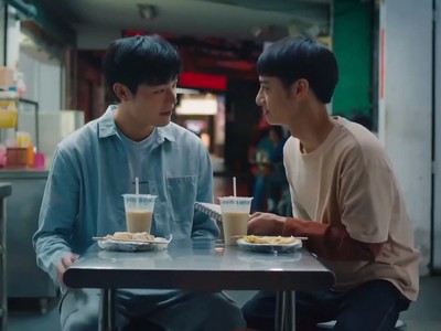Jie and Hui enjoy a meal together.