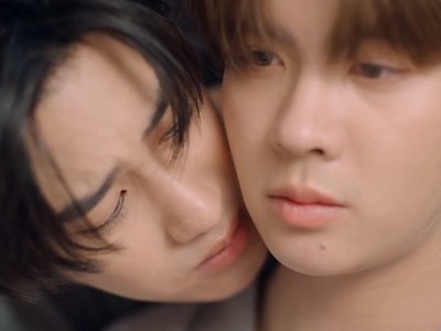 Jin puts his face close to An.