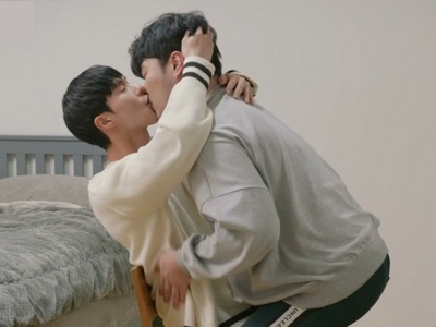 Taeho and Younghoon share an intimate kiss in the bedroom.