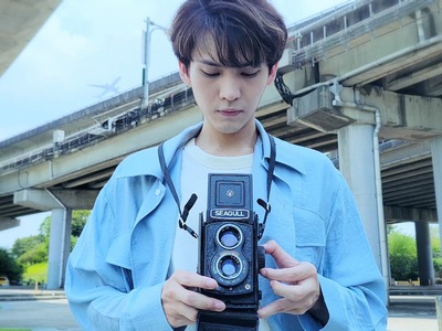 Bo Chun is finally reunited with his beloved camera in the ending.