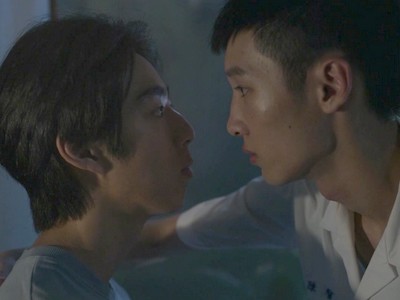 Chien Yu and Zit look at each other.