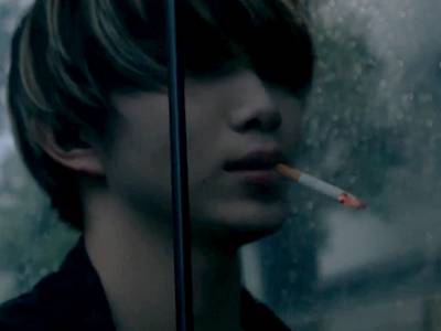 Kai smokes a cigarette and taunts Jin.