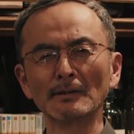 Tani is portrayed by Japanese actor Kanji Furutachi (古舘寛治).