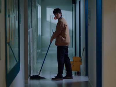 Dong Joon cleans the floors.