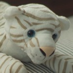 Pat's doll is a stuffed tiger.