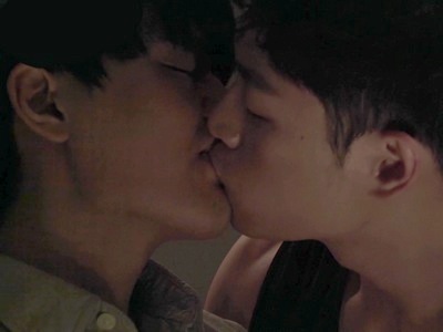 Minjae and Geonwoo share a passionate kiss in the bedroom.