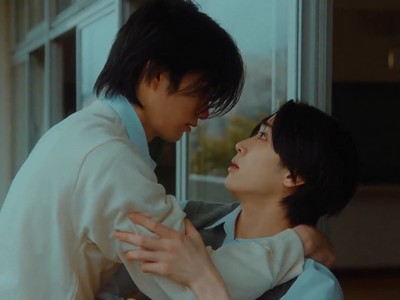 Amai and Yusaku share an intimate moment.