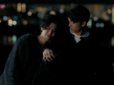 Yuma and Itsuki hold hands at night.