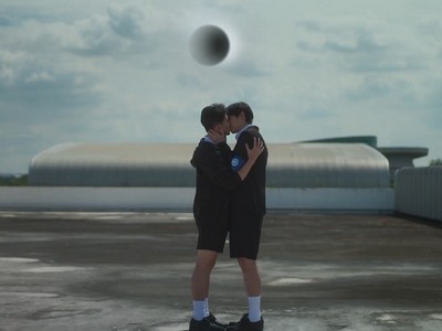 Akk and Aye share kiss on the school rooftop over an eclipse.