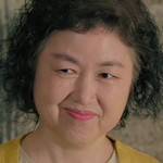 The cafe owner is portrayed by a Korean actress.