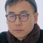 The director is portrayed by a Korean actor.