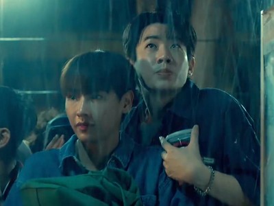 Ryan and Jane wait in the rain.