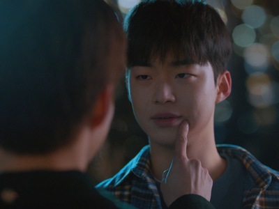 Seo Joon touches Ji Woo's face during an intimate moment.