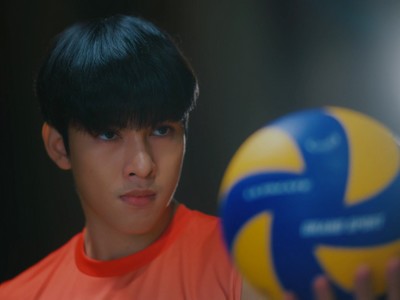 Zee stares at a volleyball.