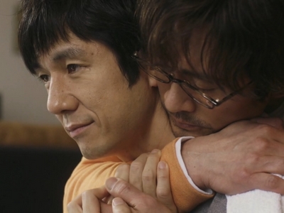 Kenji and Shiro embrace in Episode 12.